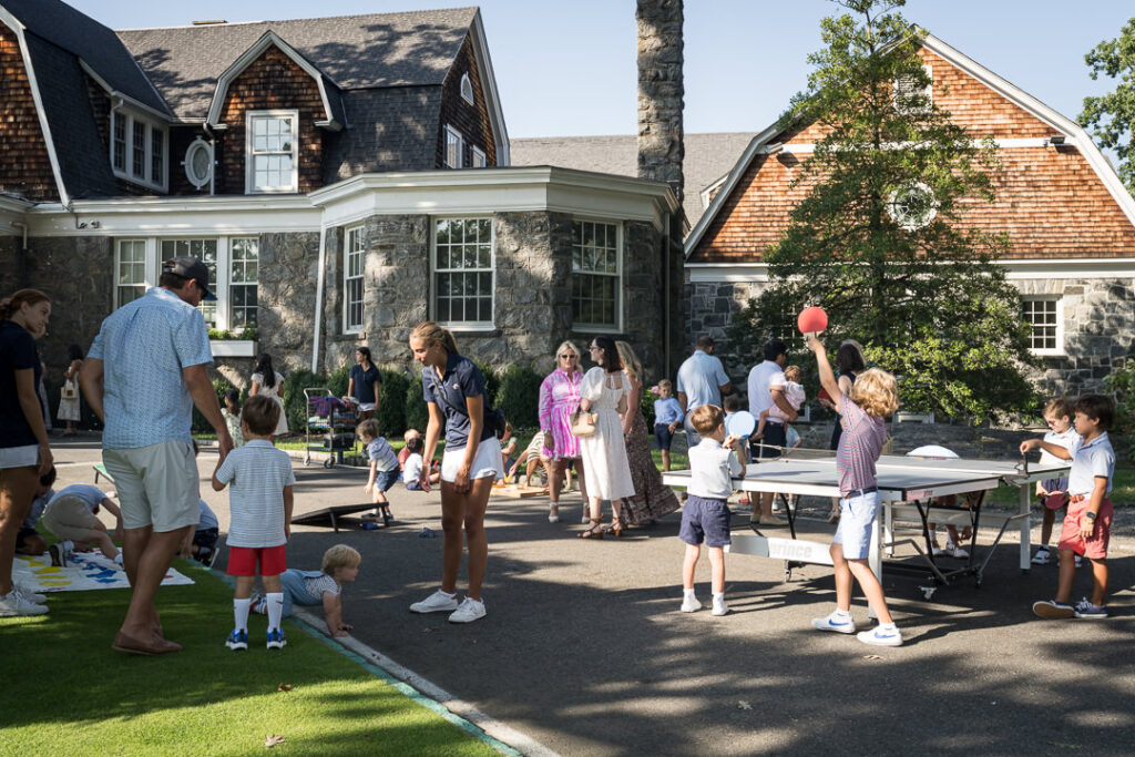 Children playing ping pong and lawn games at The Apawamis Club photographed by Alex Kaplan