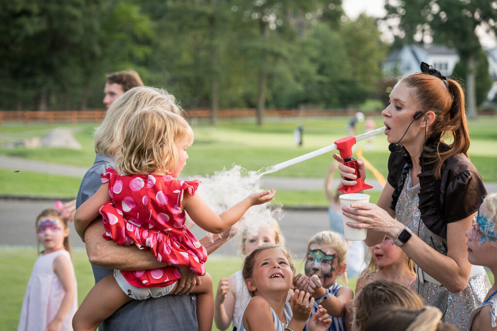Portrait of child with face paint at The Apawamis Club photographed by Alex Kaplan