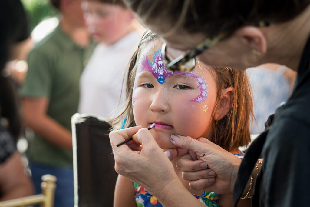 Close-up of face painting at The Apawamis Club Labor Day celebration photographed by Alex Kaplan