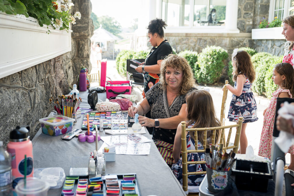 Face painting station at The Apawamis Club Labor Day BBQ photographed by Alex Kaplan