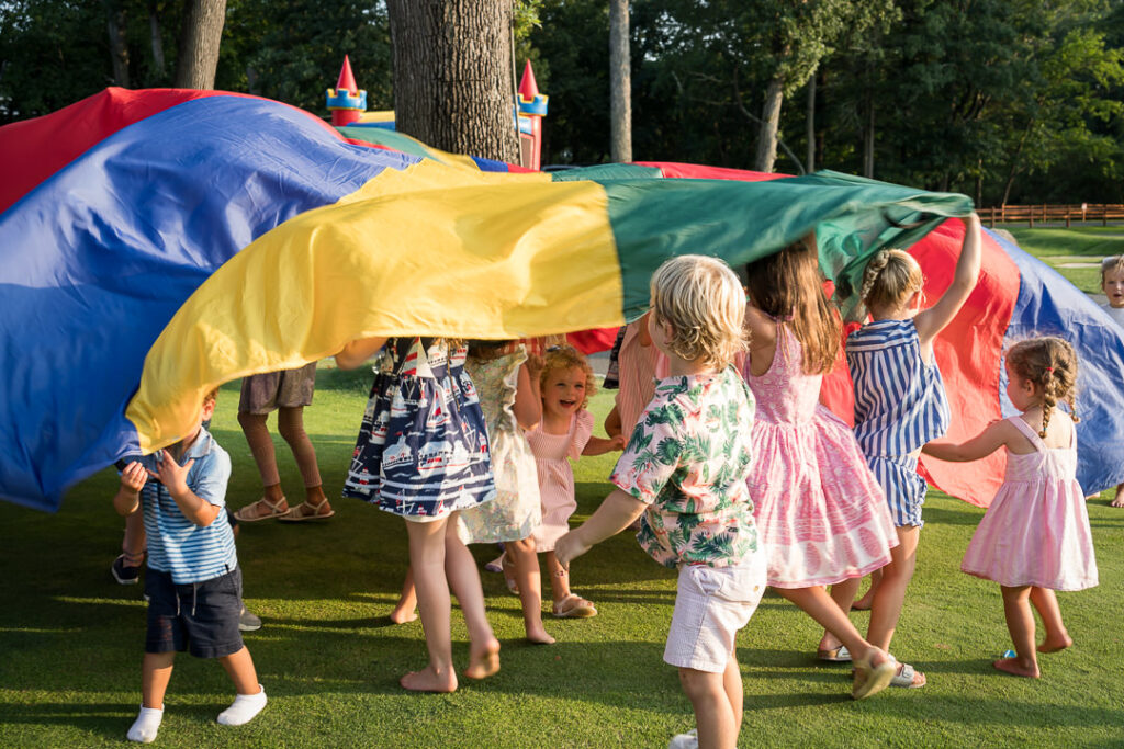 Group portrait of Apawamis Club members at Labor Day BBQ photographed by Alex Kaplan
