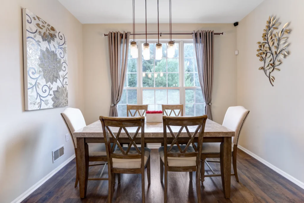 Elegant dining room with chandelier and natural lighting in New Jersey home