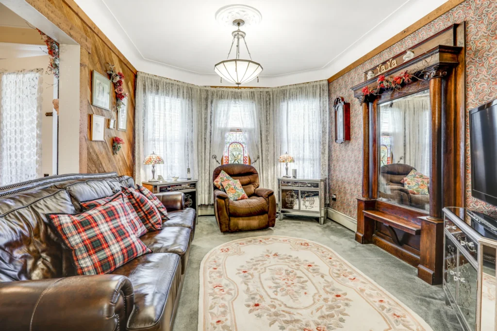 Spacious living room with large windows and modern furniture in Northern New Jersey