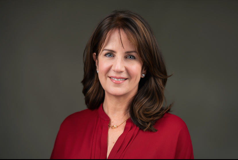 A confident professional portrait highlighting a polished, strategic personal brand.