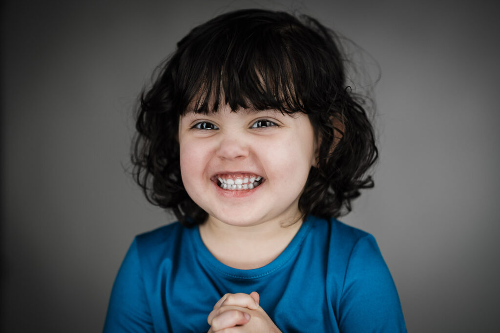 Child actor headshots NJ toddler big full smile blue shirt Bergen County