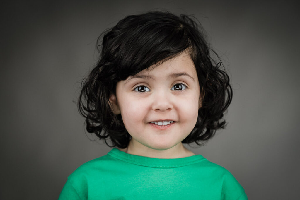 Child actor headshots NJ toddler sweet smile green shirt Bergen County photographer