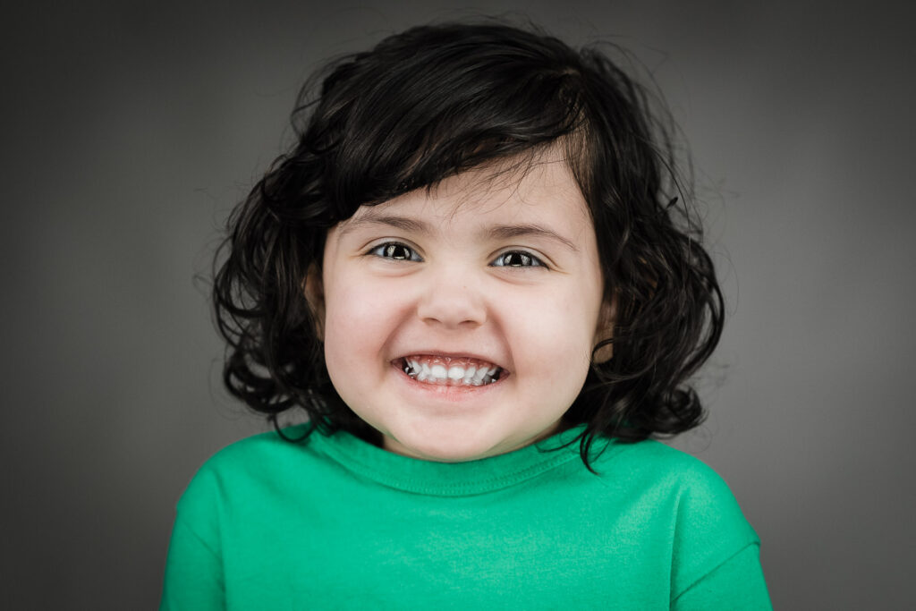 Child actor headshots NJ toddler big smile green shirt Northern New Jersey studio