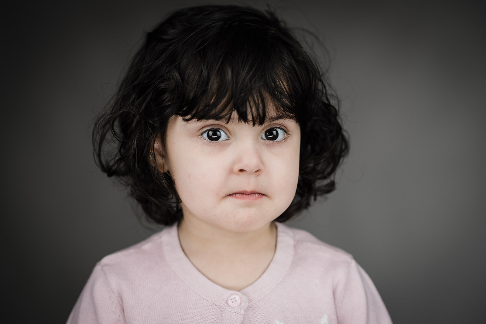 Child actor headshots NJ toddler pouty serious expression gray background