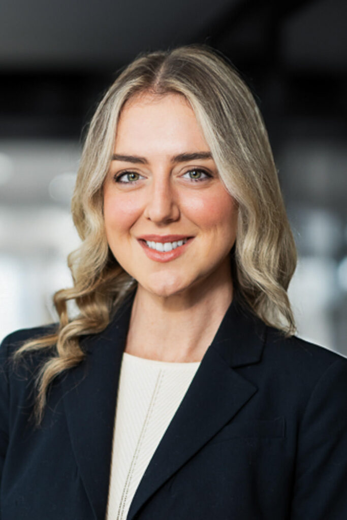 Corporate headshot with dramatic dark background for bold creative professional branding