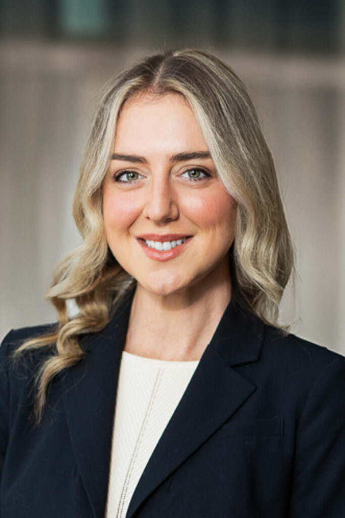 Corporate headshot with neutral gray soft background for versatile professional use