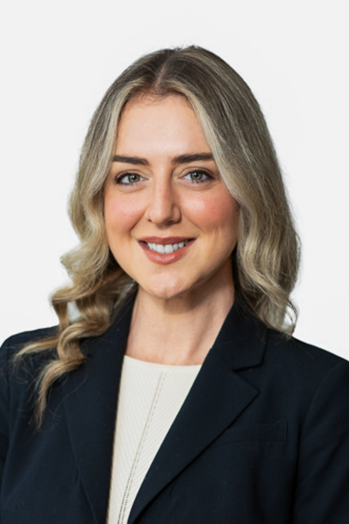 Professional corporate headshot on clean white seamless background for standardized directory