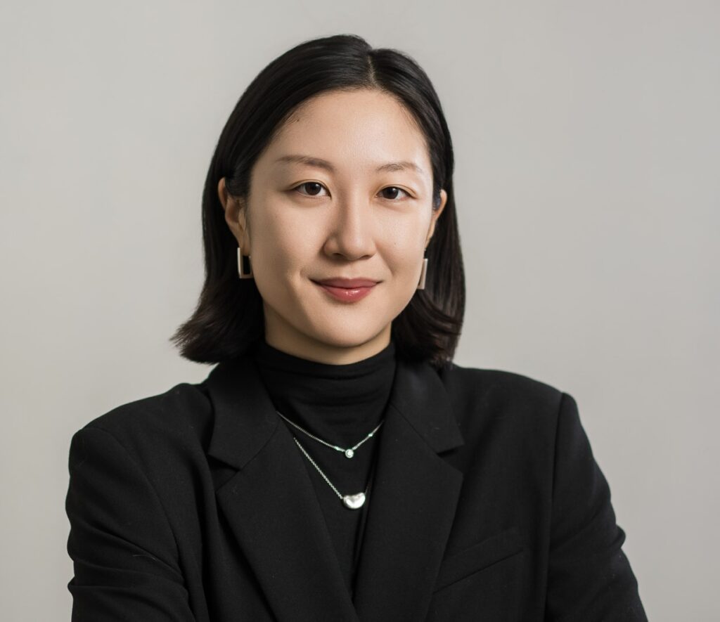 Professional female headshot on dark gray studio background suitable for dental school applications — New Milford NJ studio