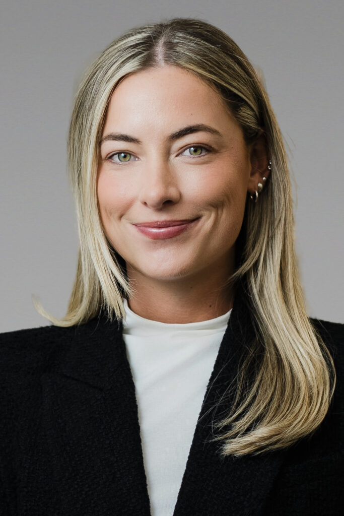 Female professional with confident natural smile in NYC studio headshot