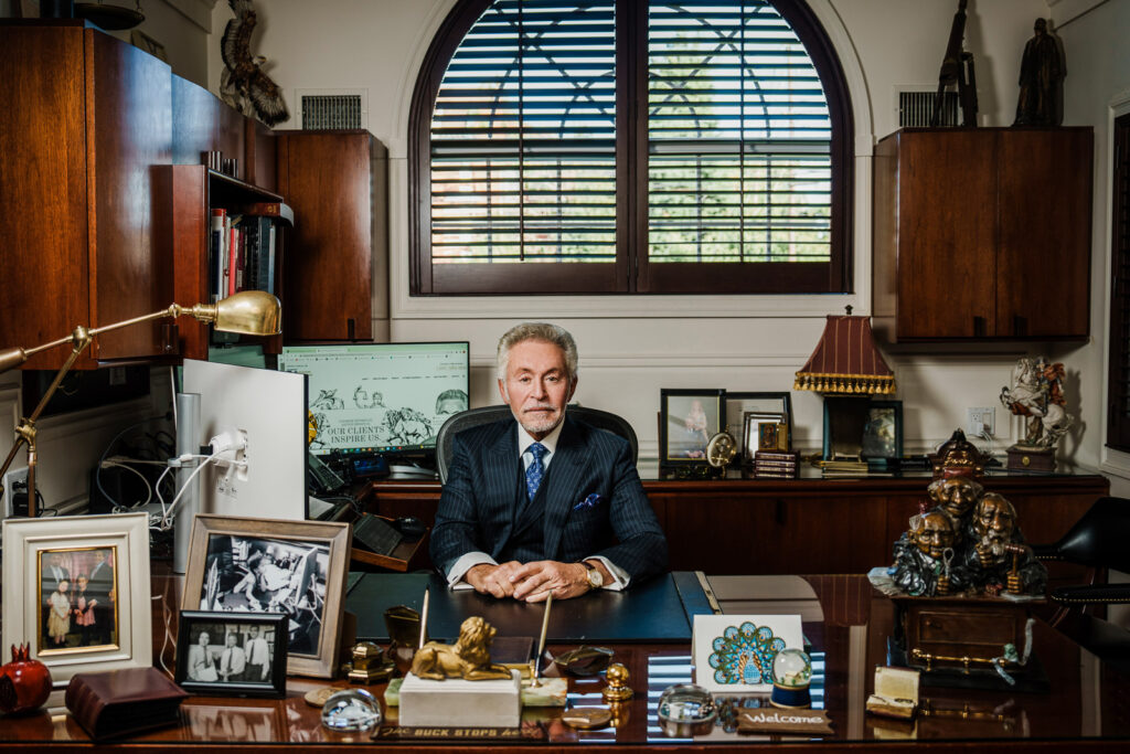 Senior partner attorney at desk wide angle office portrait Bergen County law firm