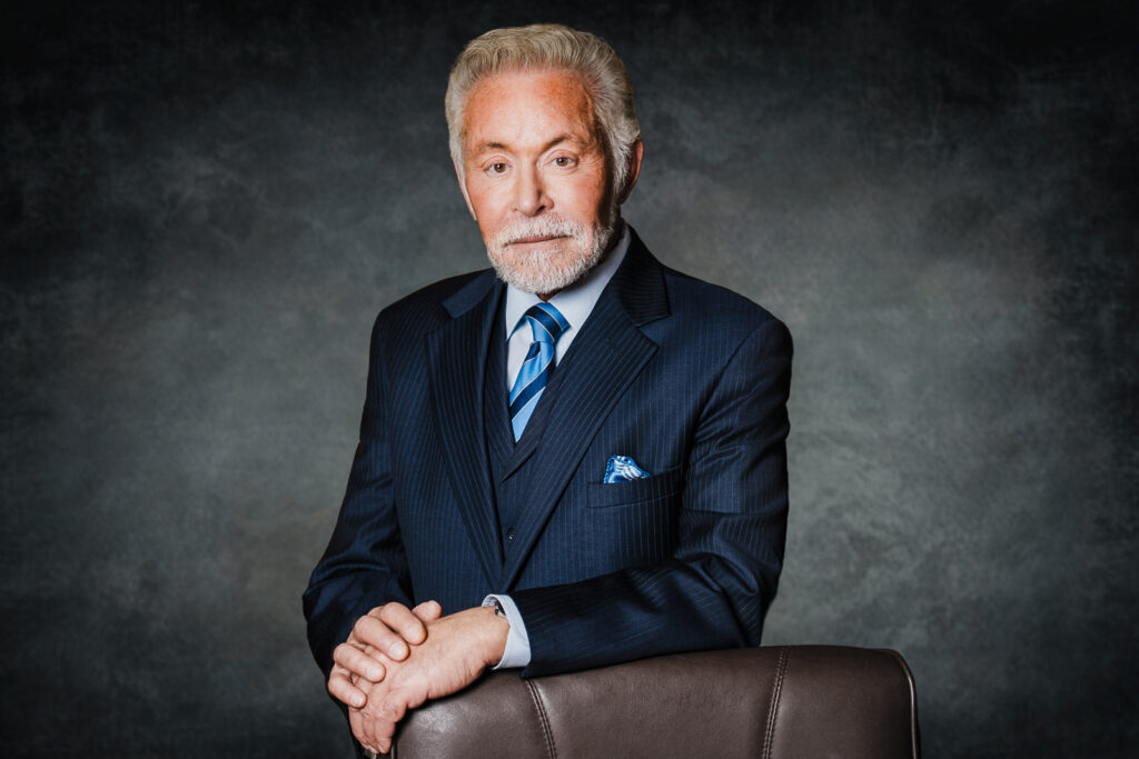 Senior partner attorney professional headshot neutral gray studio background Bergen County