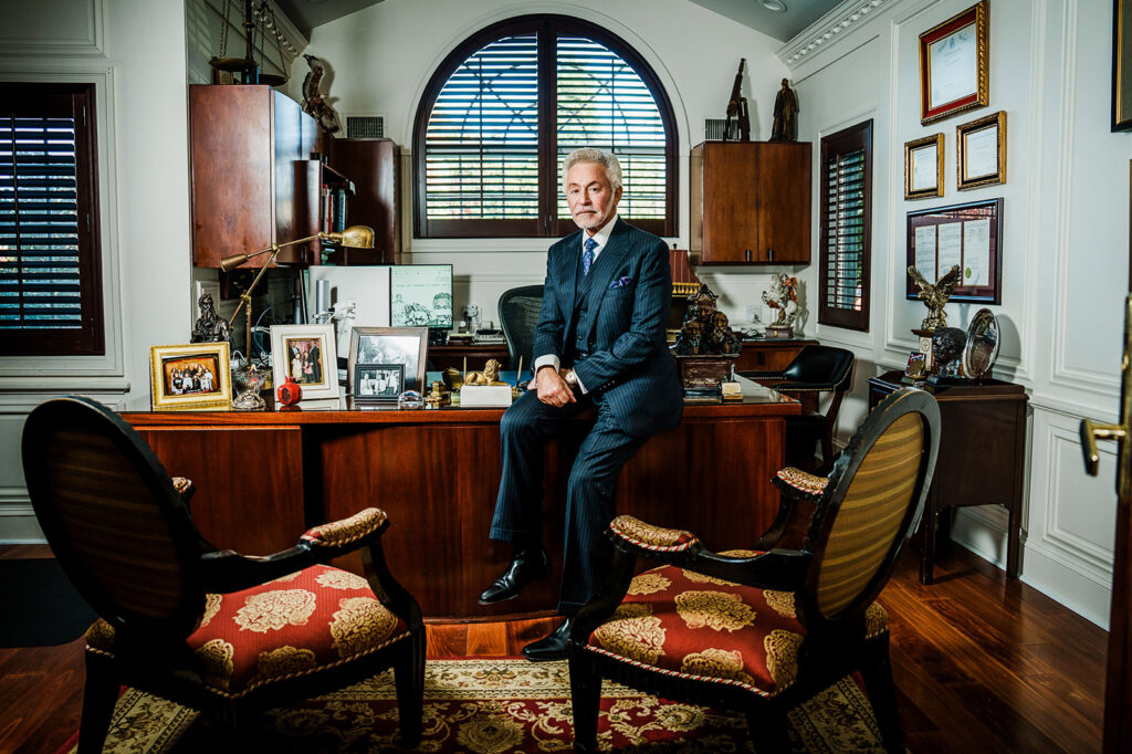 Senior partner attorney desk portrait with arched window law office Bergen County