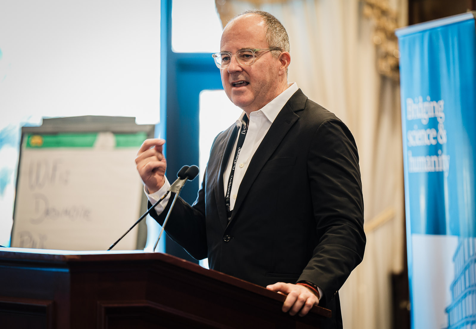 Full corporate team seated in elegant ballroom at a company retreat in Northern New Jersey