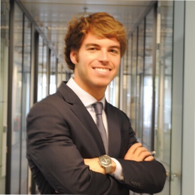 Ignacio Alonso smiling with arms crossed in an office setting in his previous LinkedIn profile