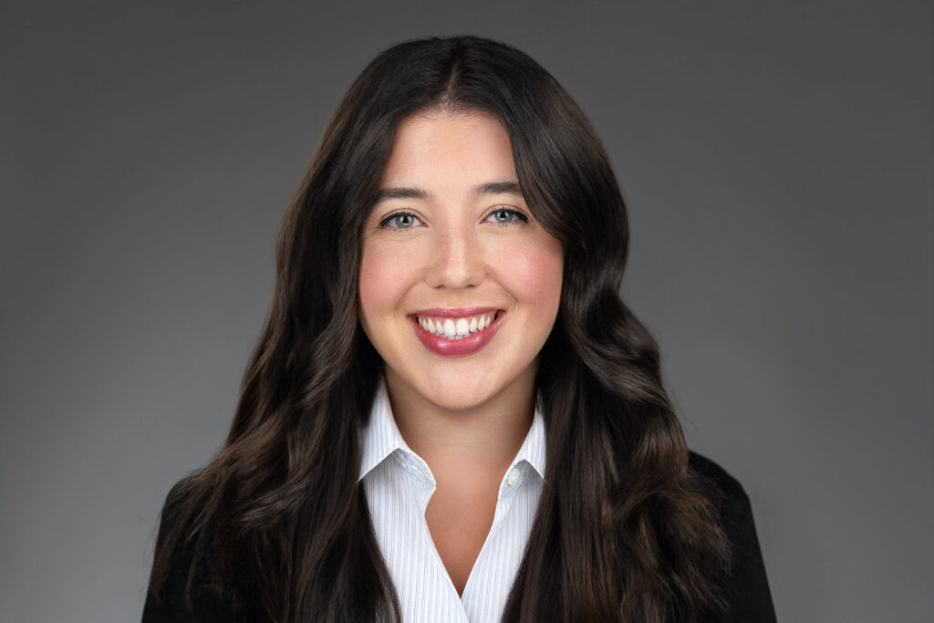 Jade Petersen smiling naturally during a professional women's headshot session in New Jersey
