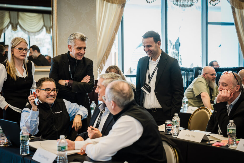 Corporate professionals mingling and networking at a business retreat event photographed in Northern New Jersey