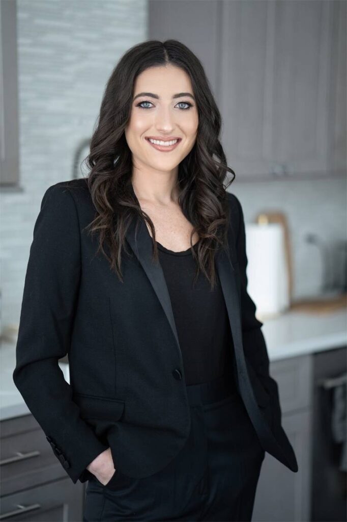 Professional corporate headshot of confident businesswoman photographed in Bergen County New Jersey office