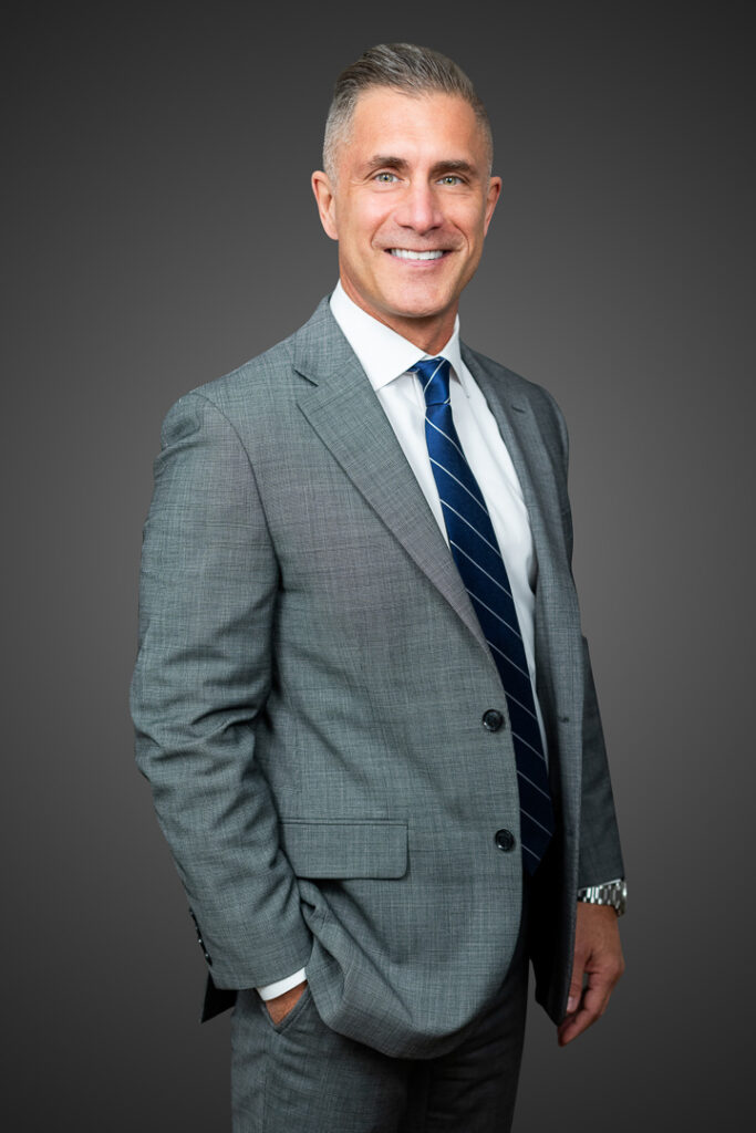 Executive portrait of a man in a gray suit photographed by Alex Kaplan in New Jersey