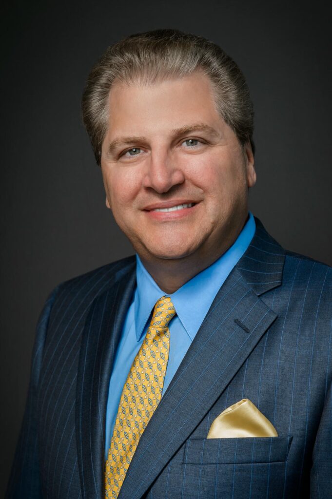 Professional CEO executive headshot in navy pinstripe suit by Alex Kaplan Northern New Jersey