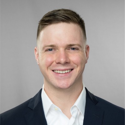LinkedIn executive headshot with natural warm smile and approachable expression for professional branding in NYC