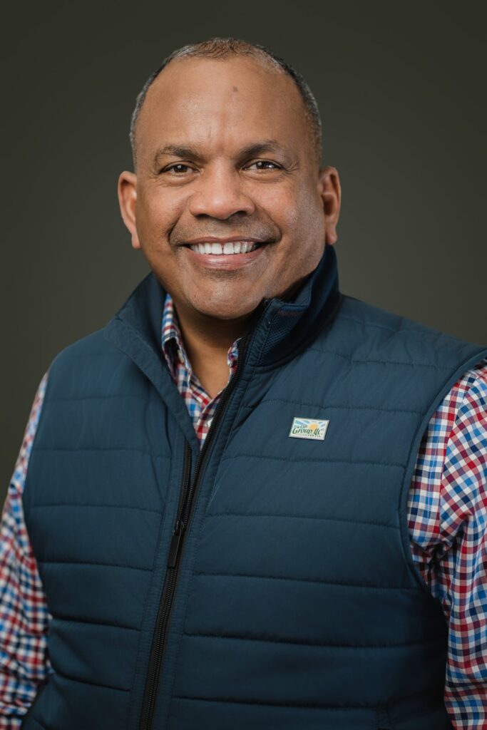 Nicholas in EXP Group branded vest during on-site corporate team headshots North Bergen NJ