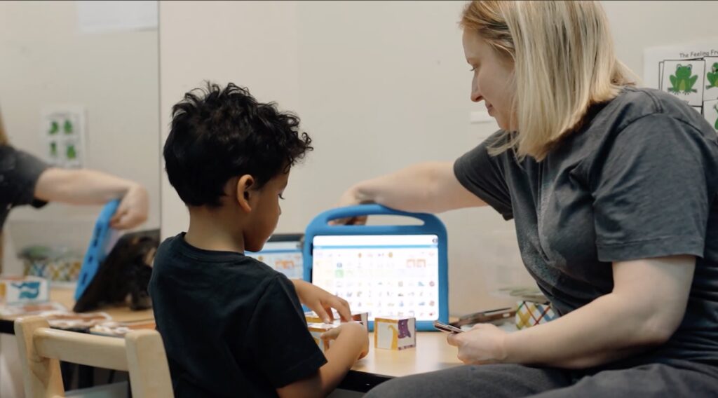 NYC nonprofit videographer documenting AAC therapy session with child and therapist Brooklyn