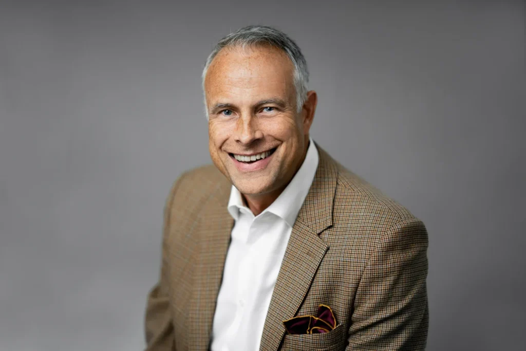 professional headshot expression coaching njRelaxed professional headshot with a natural smile from expression coaching, photographed in New Jersey