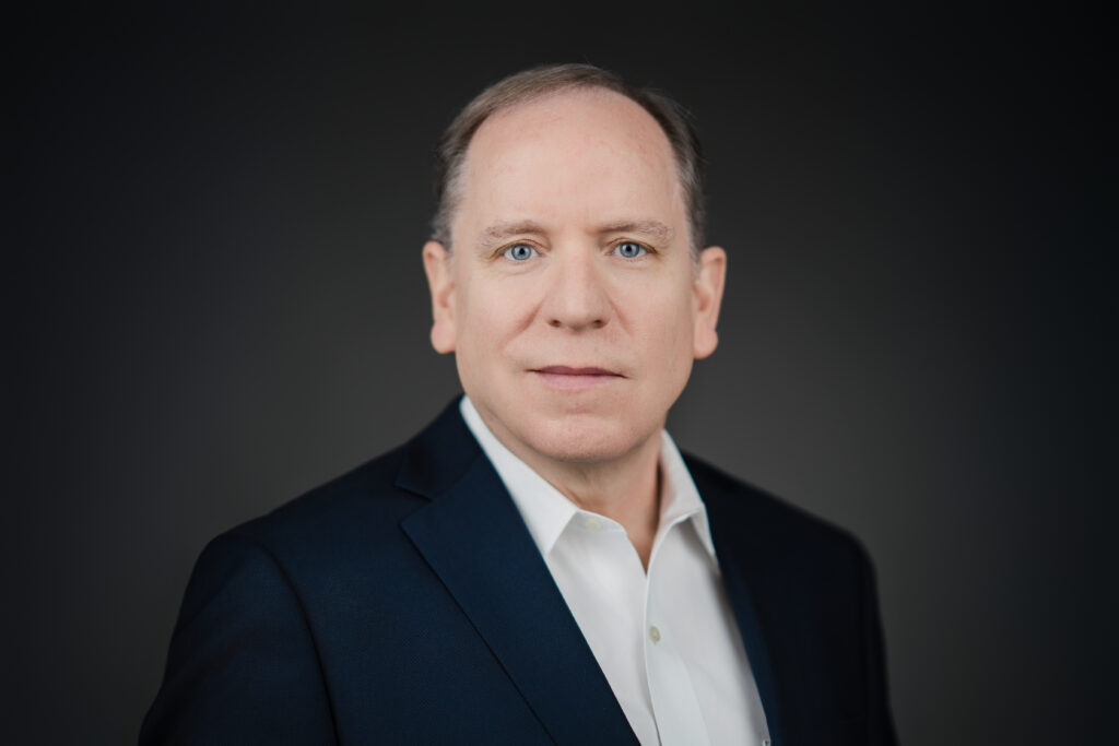 Executive portrait in Bergen County New Jersey studio showing clean wardrobe fit and professional studio lighting for a corporate headshot