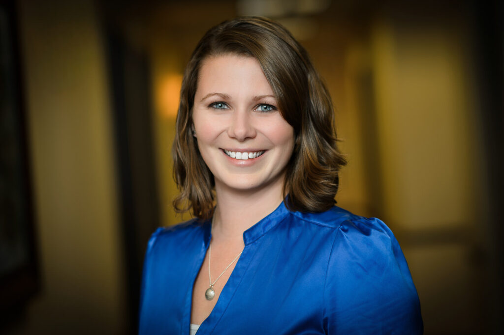 Relaxed natural headshot of a professional woman in a blue blouse during a session in New Jersey
