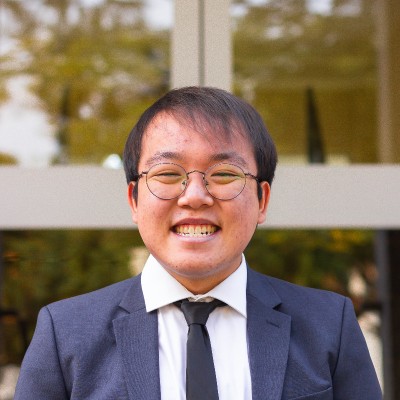 William casual outdoor LinkedIn profile photo before his professional headshot session with Alex Kaplan