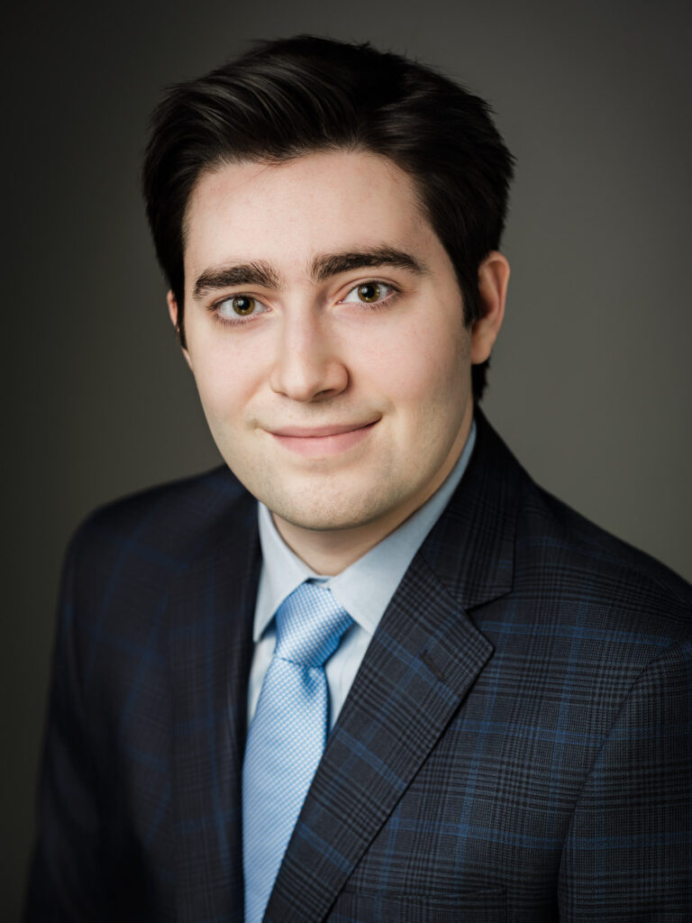 Traditional corporate headshot on a neutral studio background in Northern New Jersey.