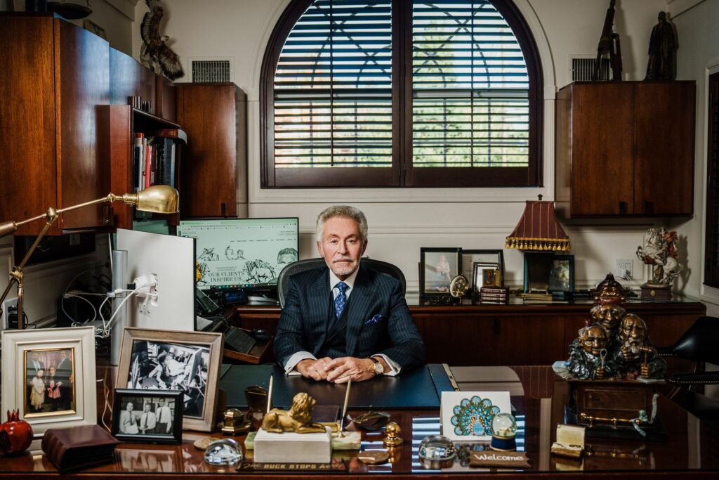 Senior partner photographed at his office desk for an environmental business portrait in Bergen County