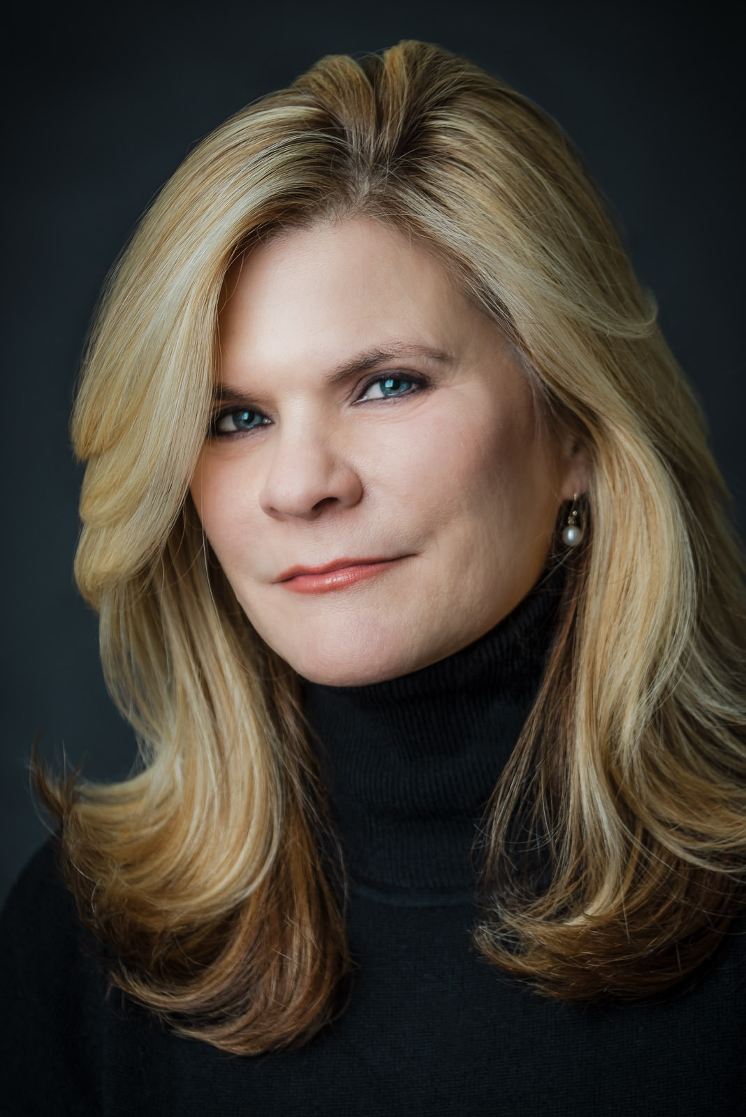 Executive headshots NJ studio portrait of a senior professional with a calm, confident expression