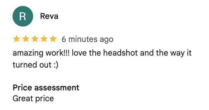 Young professional reviewing professional headshot images during photography session
