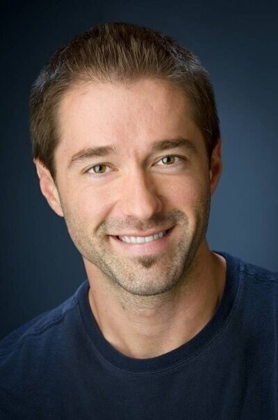 Adult actor smiling in casual headshot session at Alex Kaplan's New Jersey studio