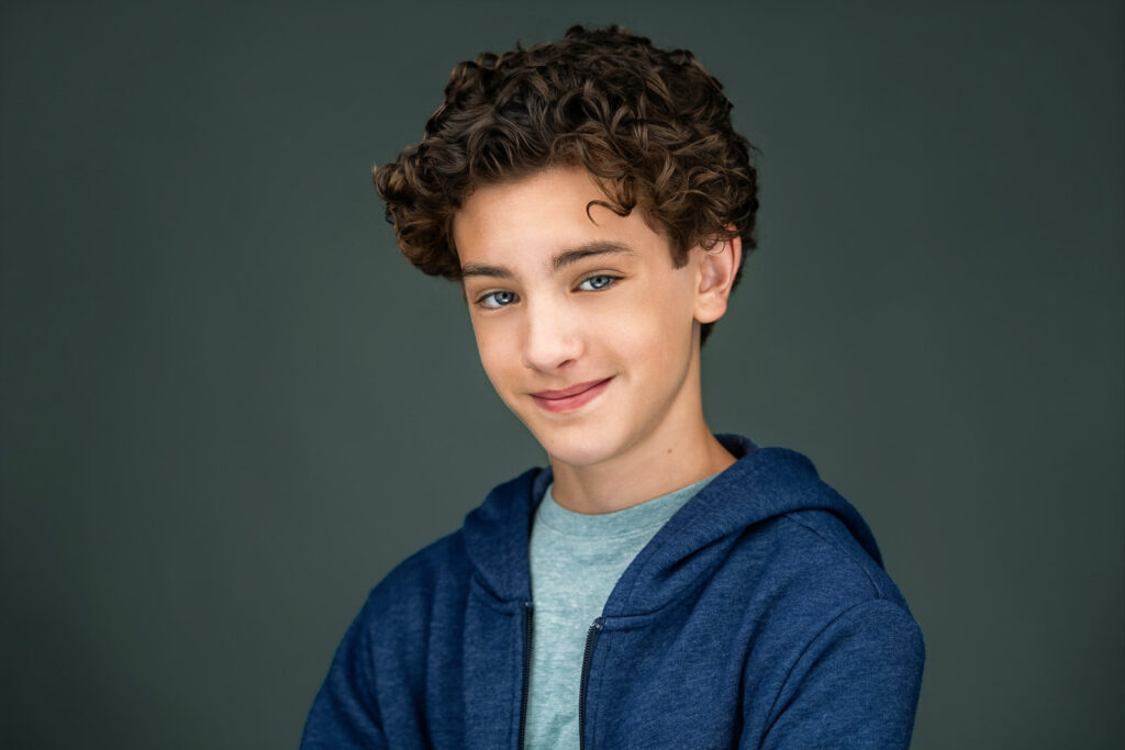 Teen actor smiling naturally in a casual headshot session in Ridgewood, NJ