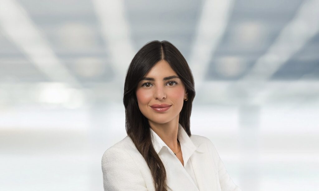 Attorney posed against bright office background during Bergen County NJ professional headshot session