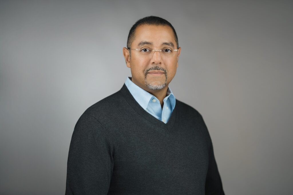 Business professional with a composed confident expression photographed in a New Milford NJ headshot studio