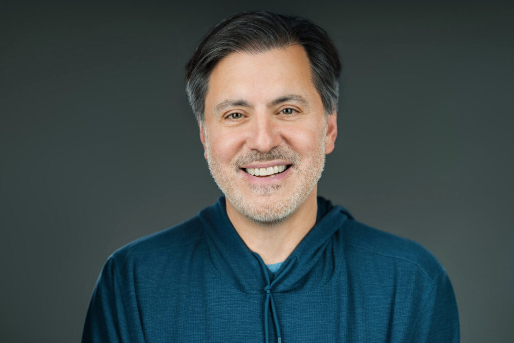 Man smiling warmly during a commercial actor headshot session in New Jersey