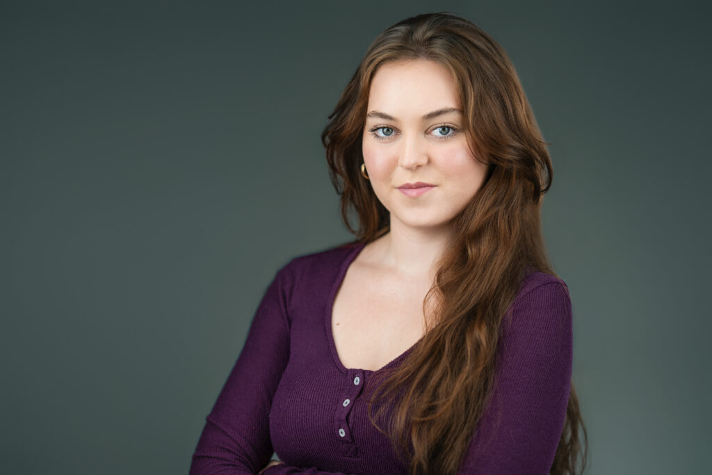 Actress smiling warmly during a commercial headshot session in New Jersey