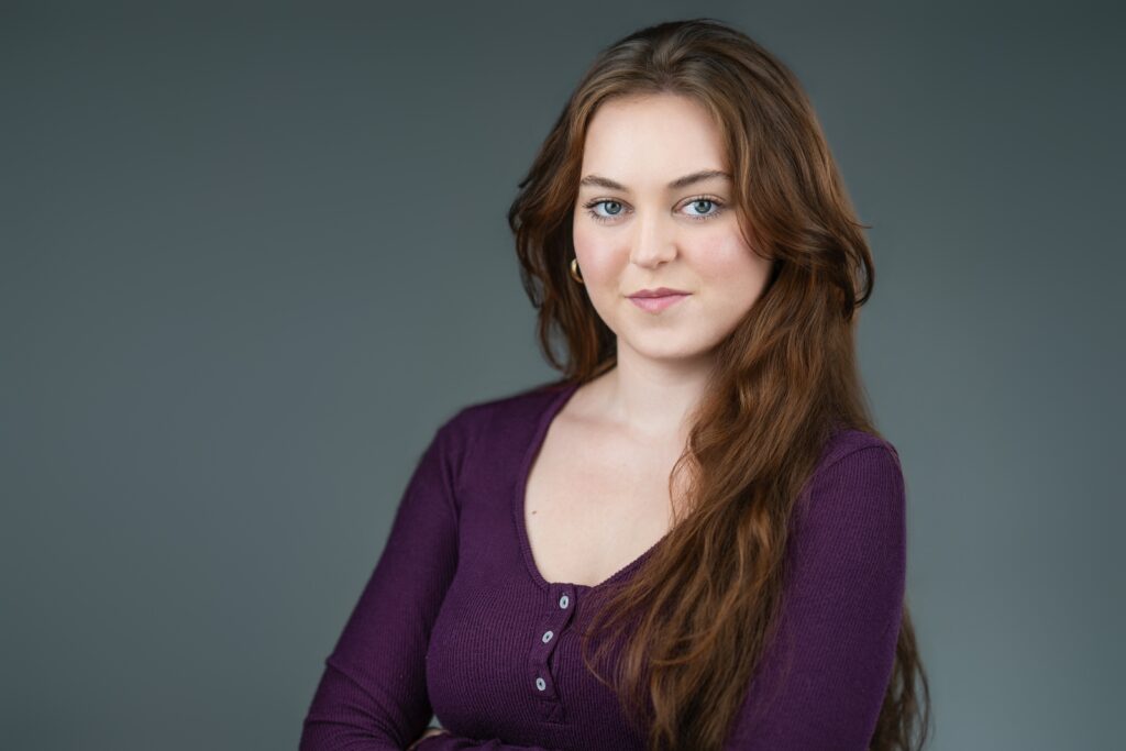 Actress smiling warmly during a commercial headshot session in New Jersey