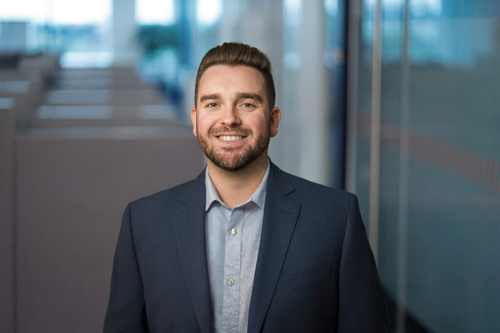 Team member photographed for corporate headshots at a Long Island engineering office