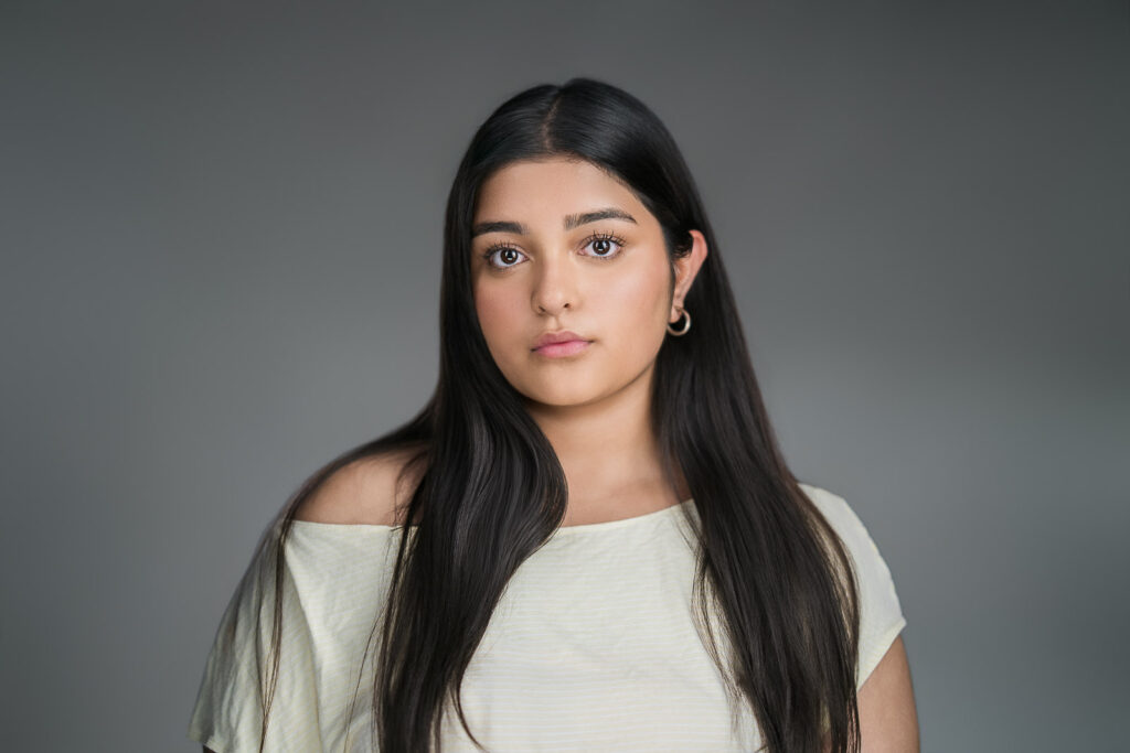 Actor headshot with natural off-shoulder styling, photographed in a Northern New Jersey studio 