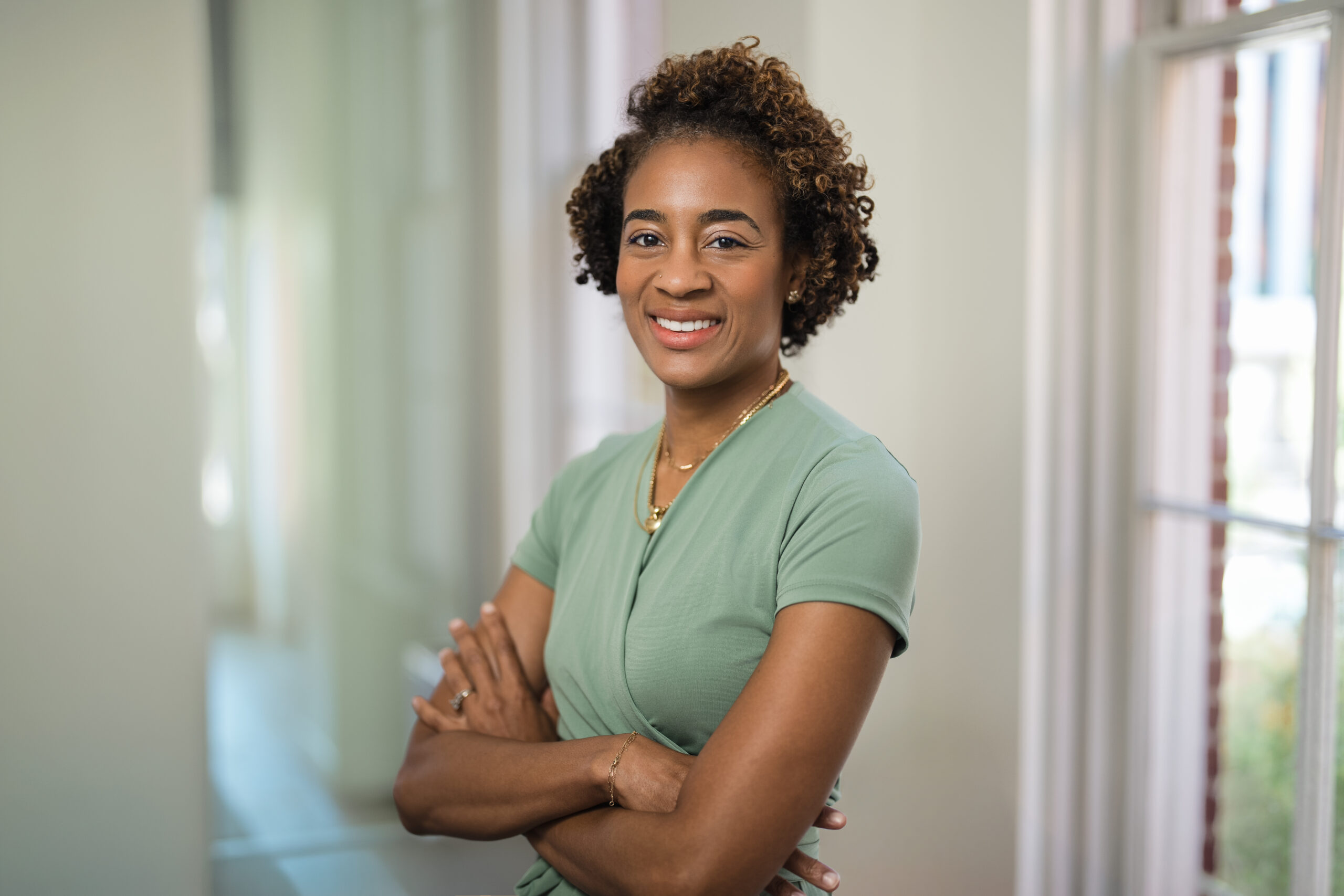Professional woman smiling confidently during a professional headshot session in New Jersey