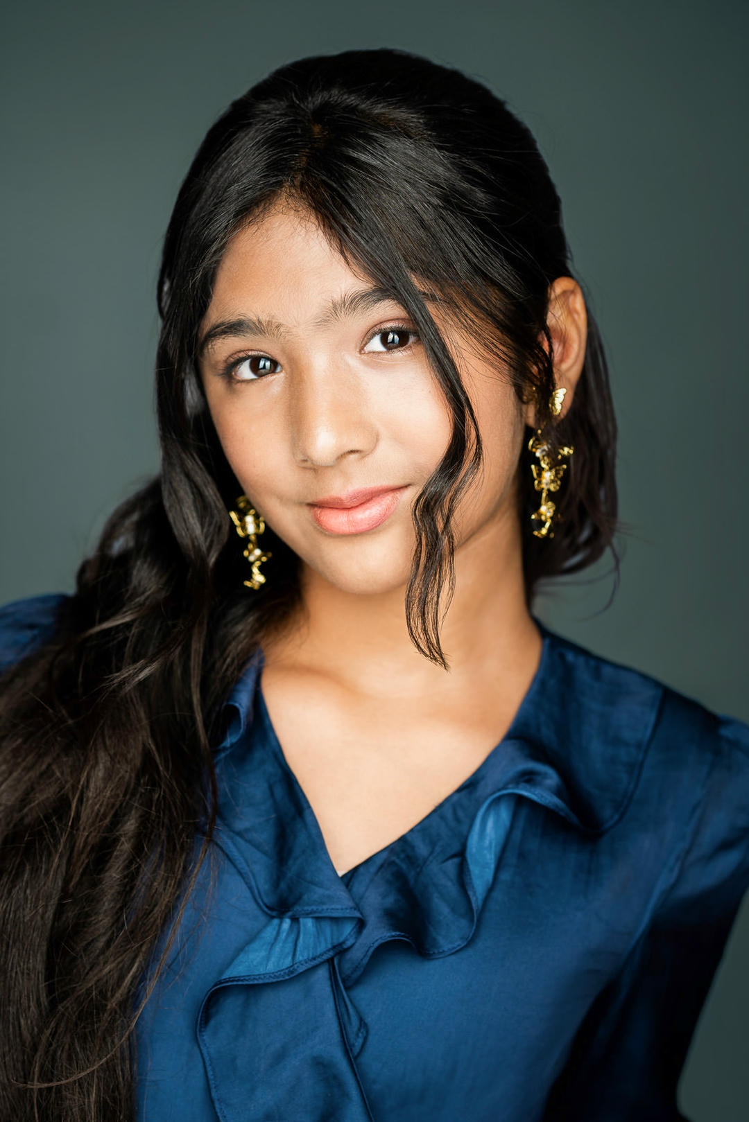 Young actor smiling confidently during a headshot session in New Jersey