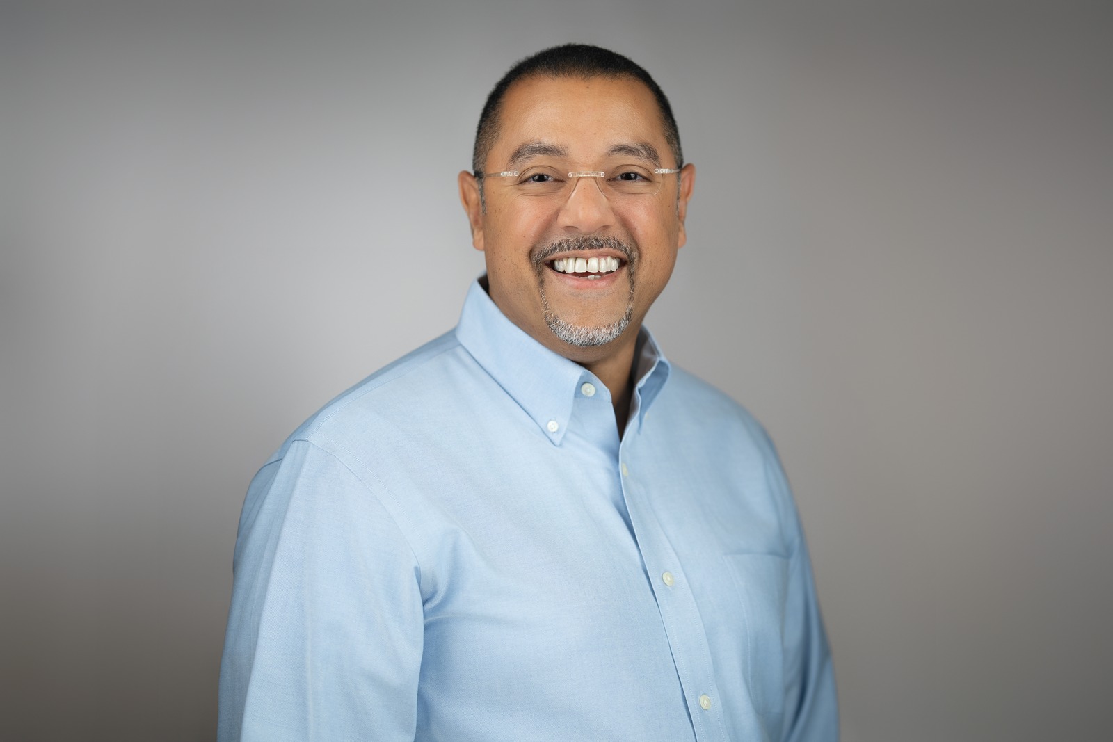 Professional LinkedIn headshot showing a modern profile photo update for a New Jersey business professional.